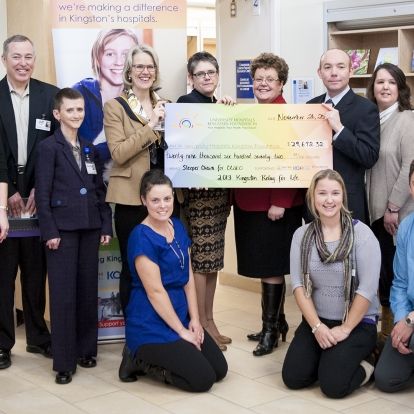 KGH staff standing for group photo around large cheque of $29,672.32 for Relay for Life
