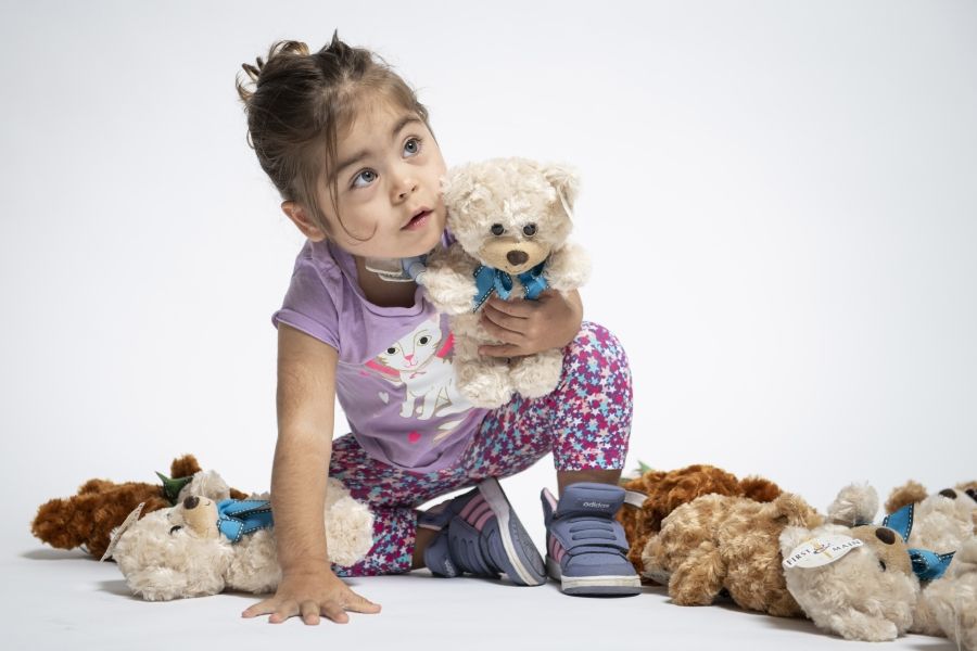 image of child with teddy bears