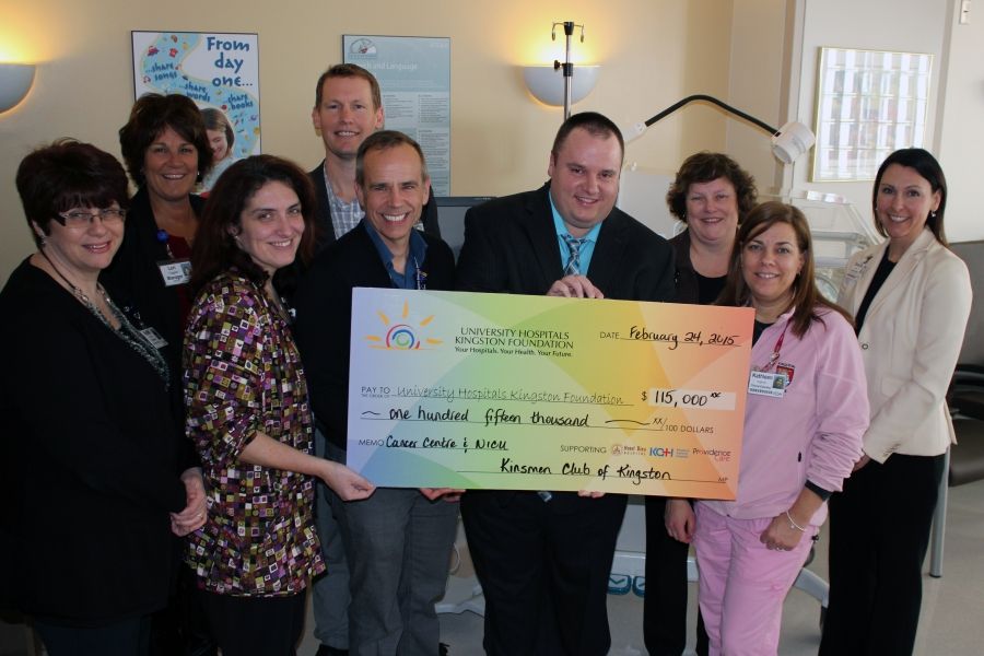 The big cheque: Kinsmen Dream Home Vice President Ryan Hanes presents a $115,000 donation from last year's lottery.