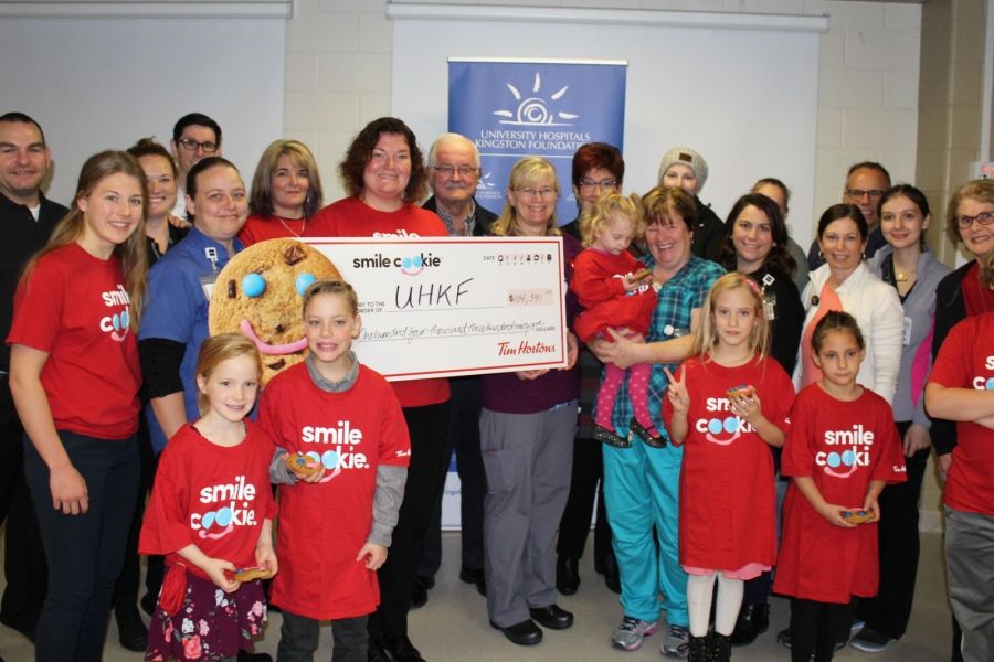 Representatives from local Tim Hortons present the proceeds of the campaign to KHSC and UHKF staff, patients and families