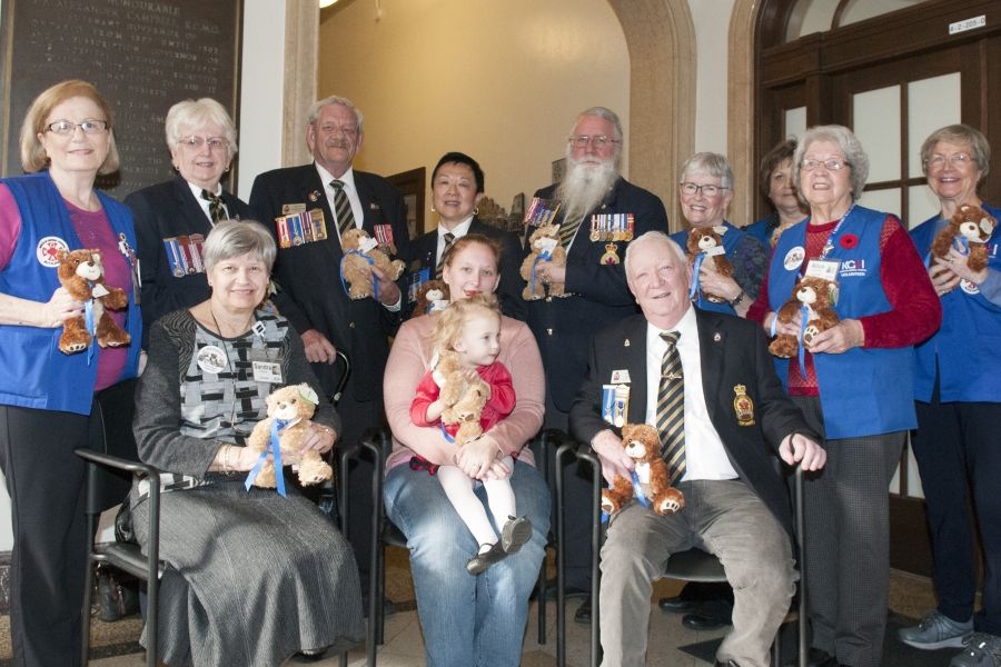 Members of the KGH Auxiliary and the Royal Canadian Legion, help Spencer and her mother Jessica launch the 2018 campaign