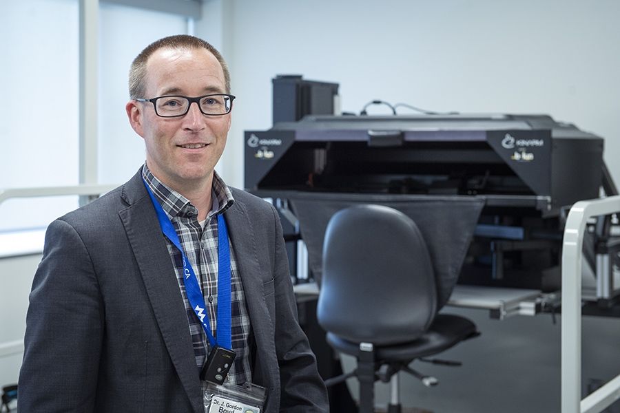 Dr. Gord Boyd with the KINARM in the W.J. Henderson Centre for Patient Oriented Research.